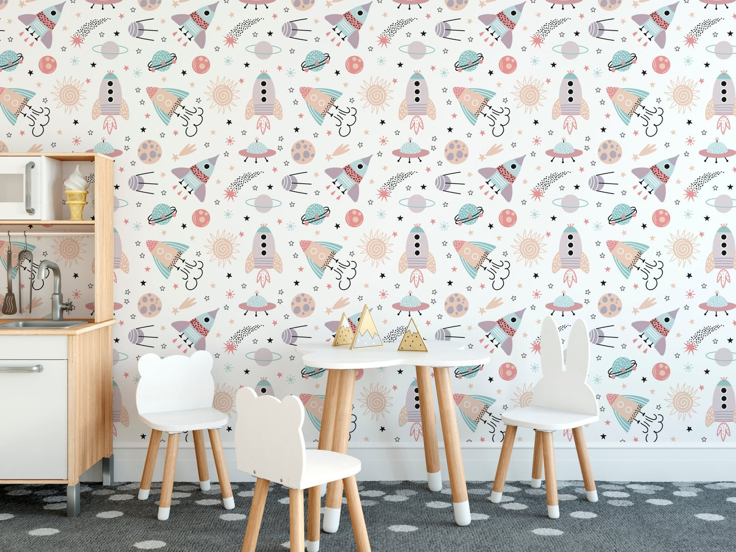 Cute space objects wallpaper for kids dining area with rockets, planets, stars and UFO pattern.