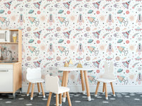 Cute space objects wallpaper for kids dining area with rockets, planets, stars and UFO pattern.