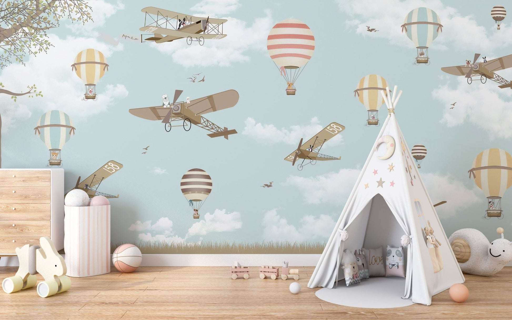 Airplane and hot air balloon mural design in children's playroom.