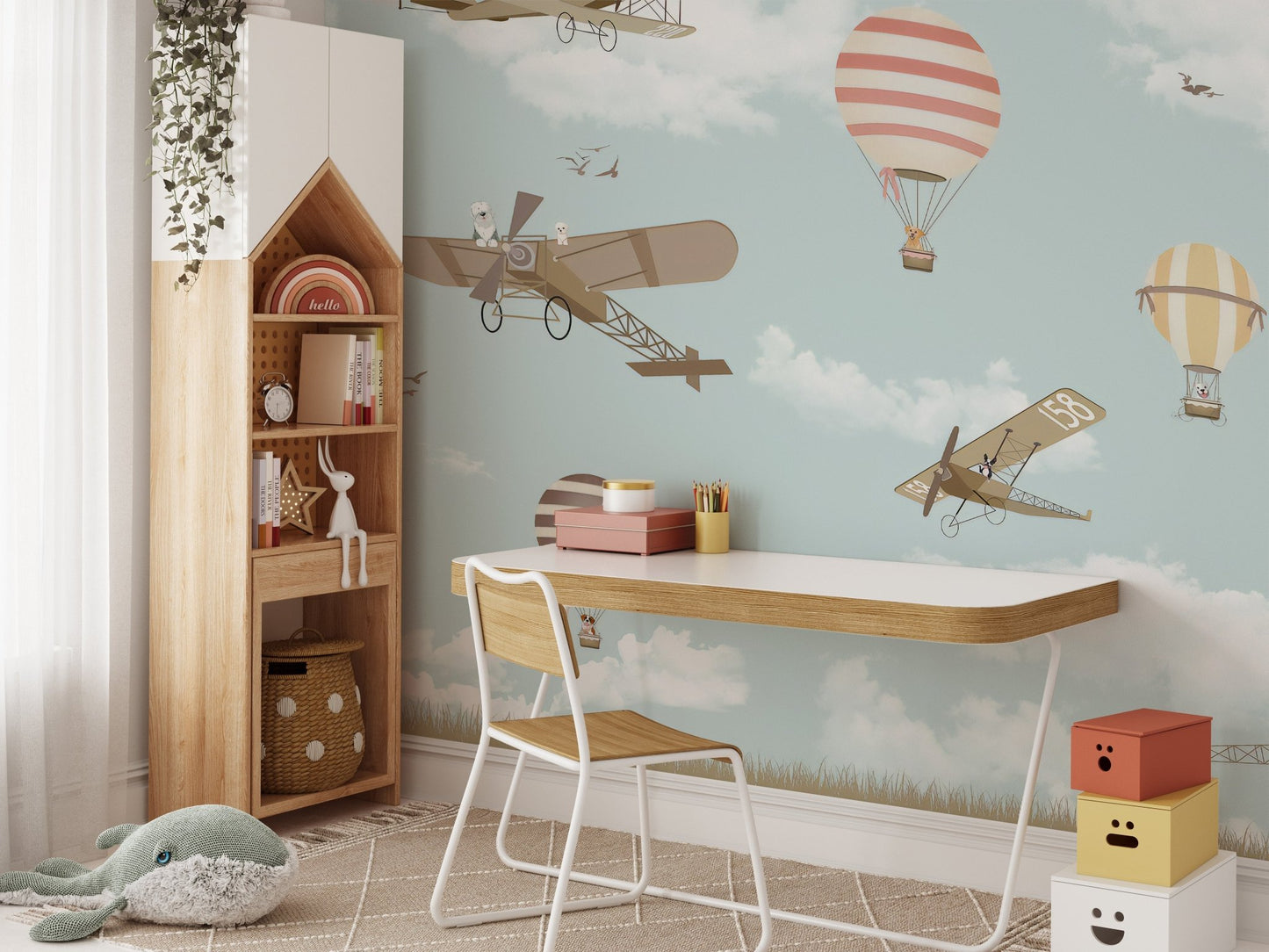 Balloon wall mural with charming plane accents in kids study space.
