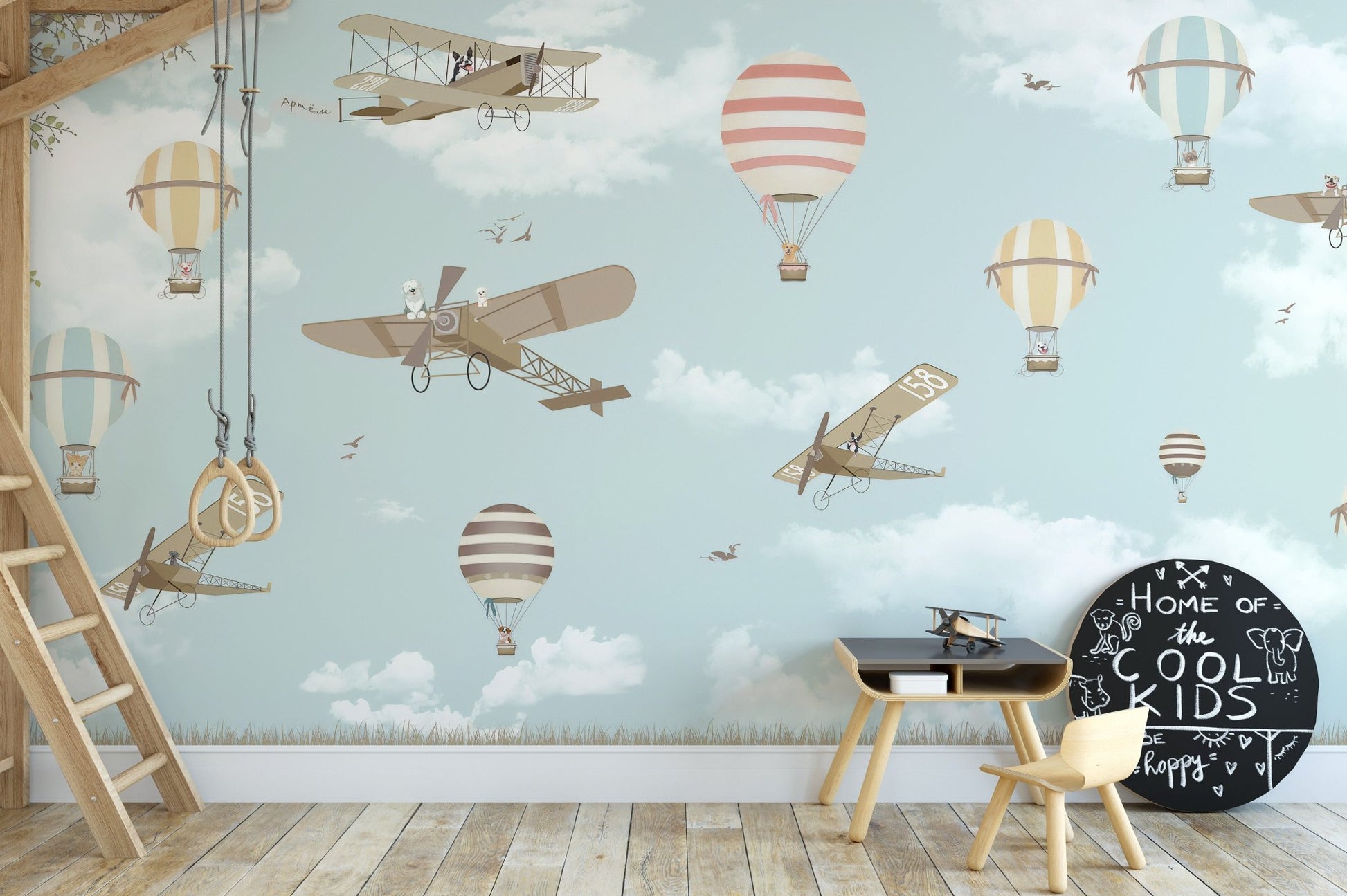 Colorful planes and balloons wall mural theme in kids activity room.