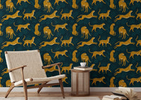 Whimsical wallpaper with tropical leaves and leopards in reading area.