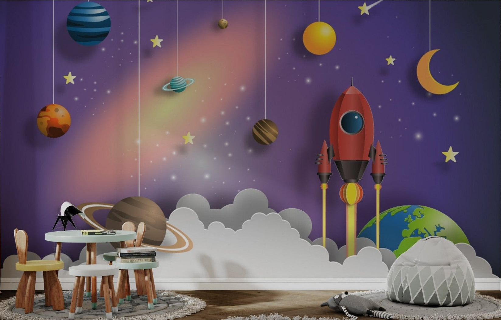 Wall mural showing red rocket and yellow moon in kids study room.
