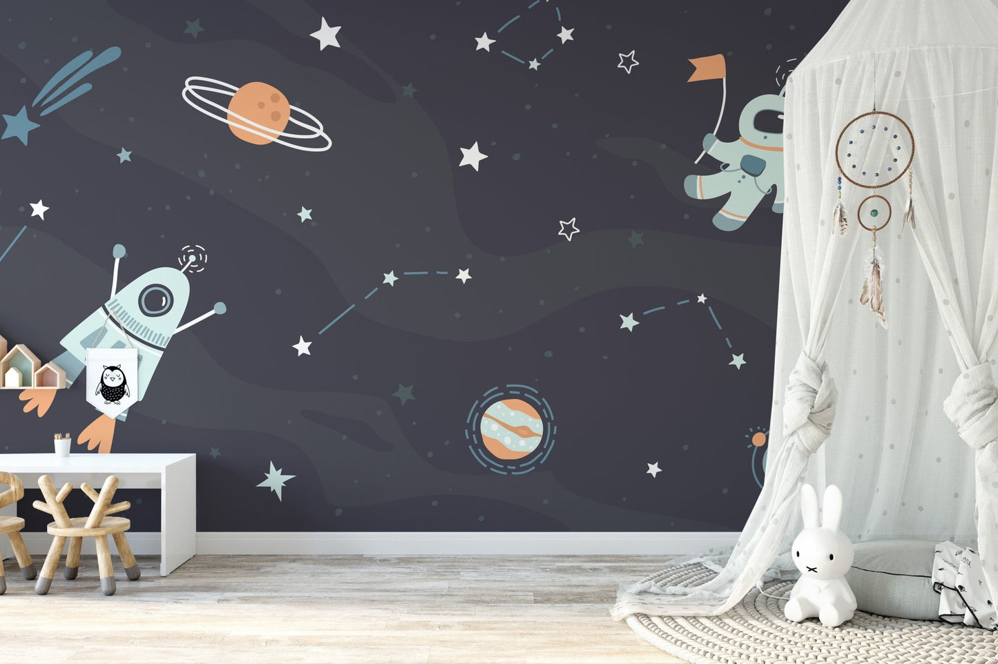 Space mural showing rockets and galaxies
