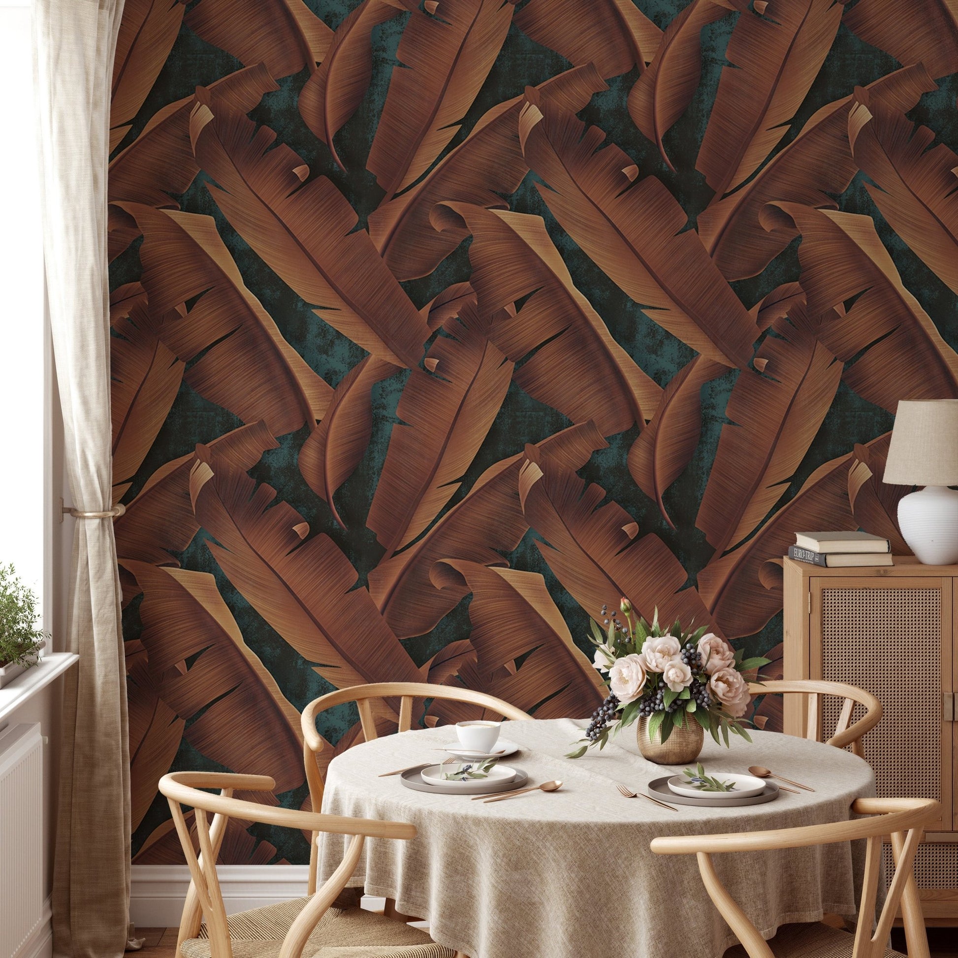 Large autumn tree leaves concrete wallpaper in a dining room with a round table.
