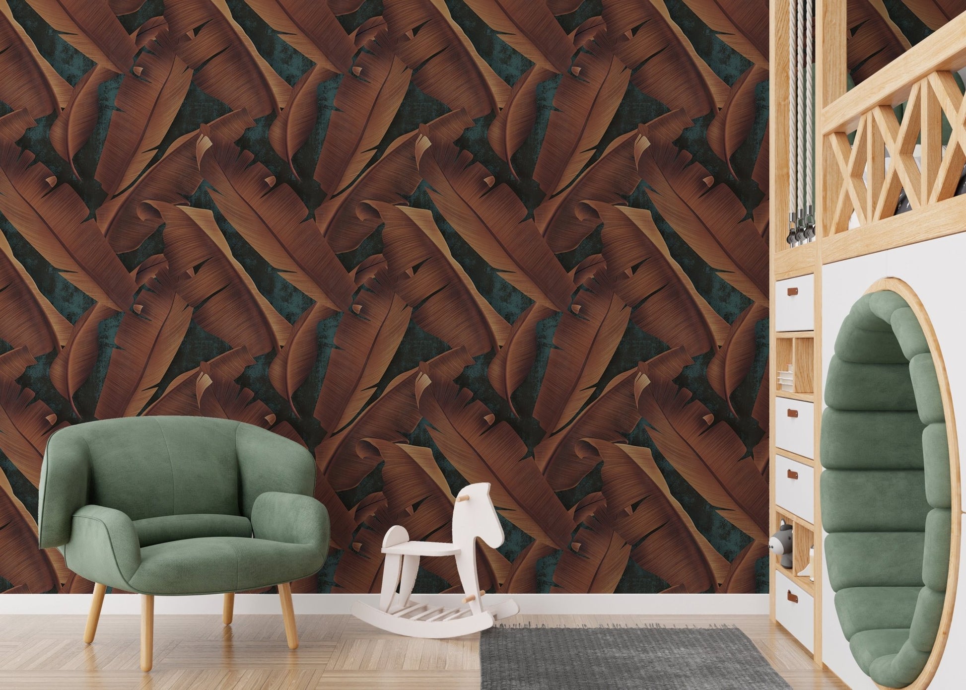 Botanical leaves wallpaper in a kids play area with a green armchair.