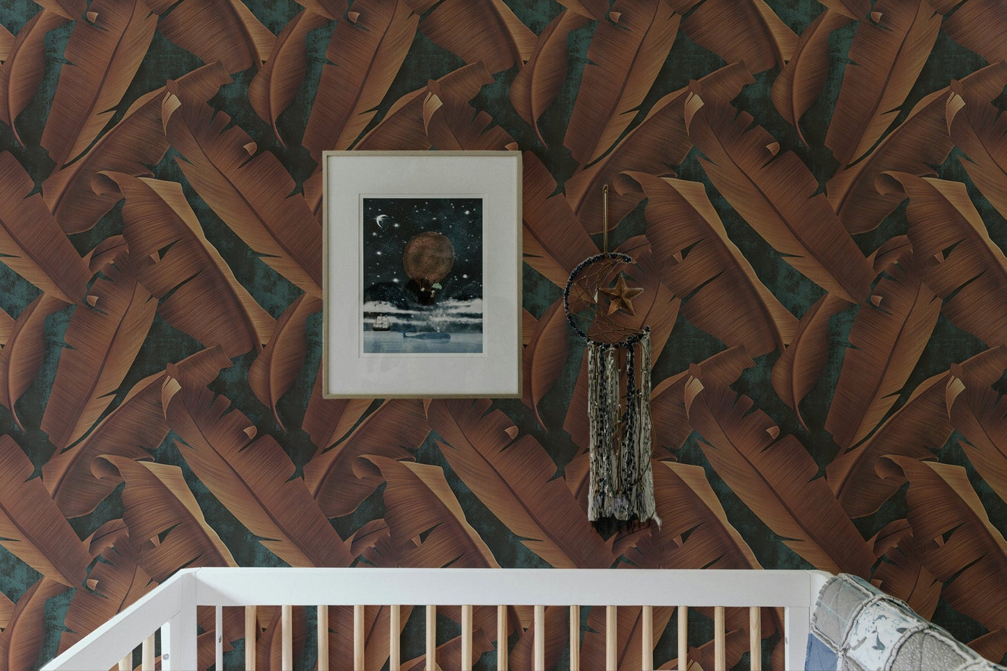 Brown foliage concrete wallpaper behind a white cot in a nursery room.