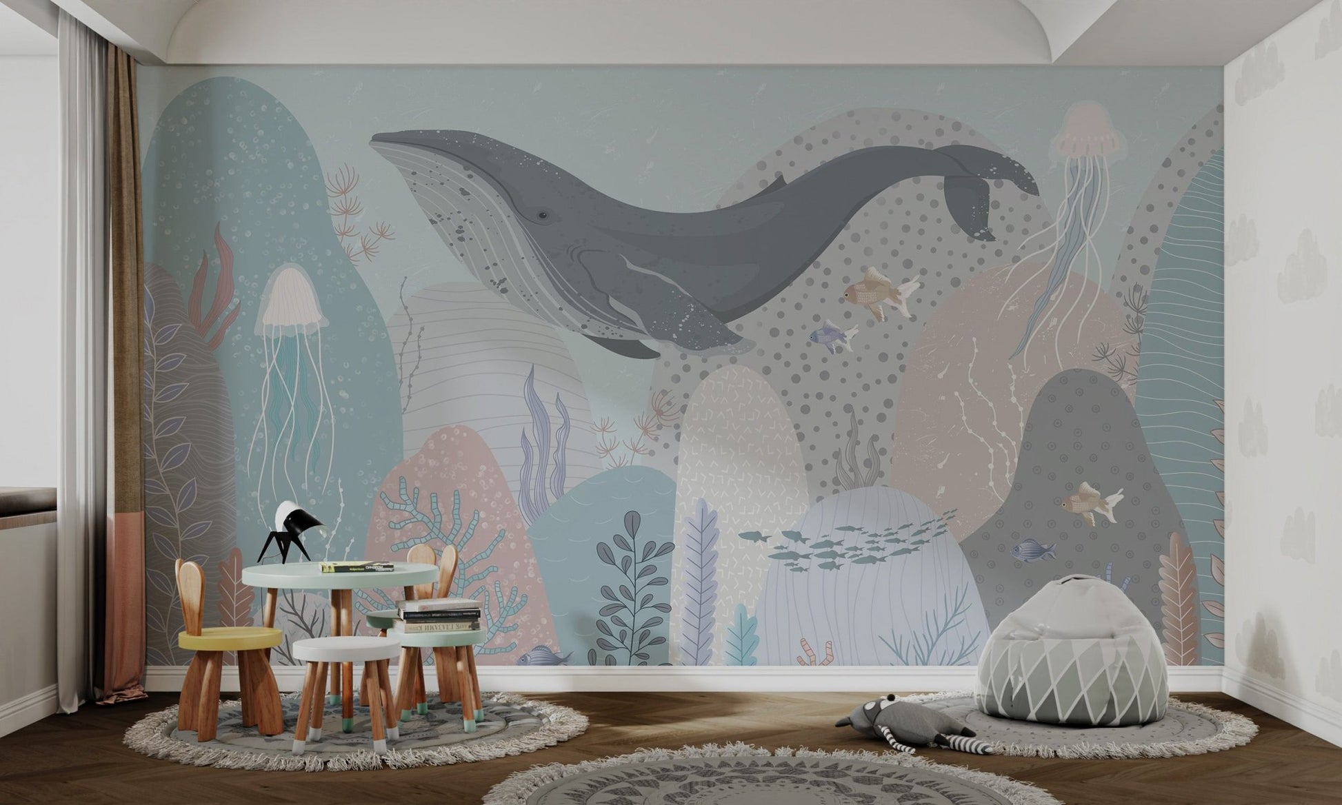 Nautical theme wall mural with jellyfish and coral in light blue for kids play area.