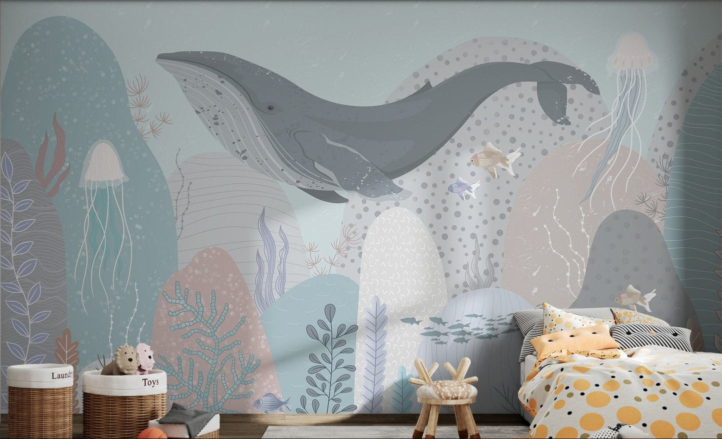 Whale-themed mural with jellyfish and fish in children's bedroom.