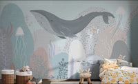 Whale-themed mural with jellyfish and fish in children's bedroom.
