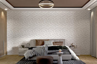 Cream colored leaf mural for a neutral bedroom feature wall design.
