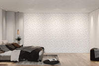 Repetitive botanical leaf wall mural in neutral white and cream tones.