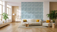 Spacious living area with and blue leaves wallpaper.