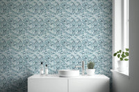 Leaves In Deep Blue Wallpaper used in a white bathroom setting.