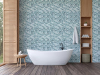 blue leaf pattern wallpaper in bathroom.
