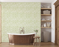 Pale green leaves wallpaper in modern bathroom.