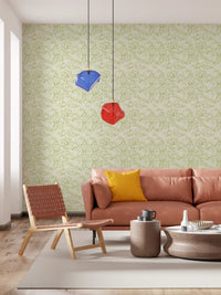 Modern living area with a green leaf wallpaper.