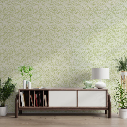 Modern room with a light green botanical wallpaper.