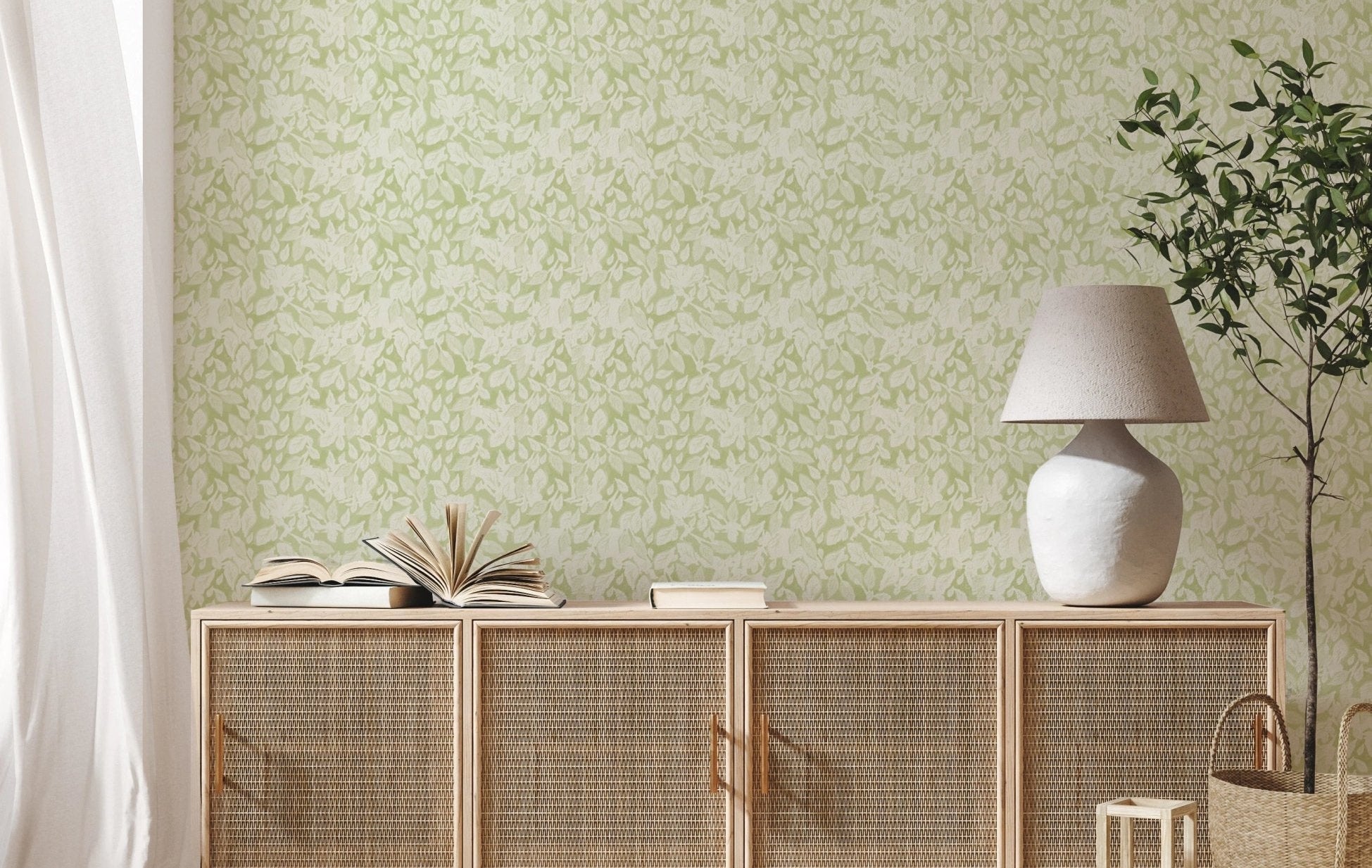 Living room corner with delicate green foliage wallpaper.