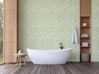 Green leaf pattern wallpaper as bathroom backdrop.