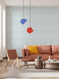 Light blue leaf wallpaper in a living room backdrop.