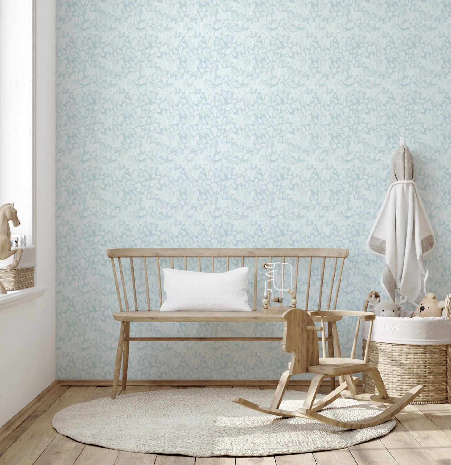 Sky blue wallpaper in a nursery interior.