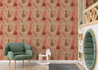 Nursery with a green armchair and vintage vase print wallpaper.