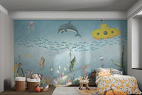 Yellow submarine with underwater scene wall mural in bedroom.