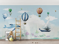 Light Blue Balloon Whale Wall mural with sailboats and pastel mountains.
