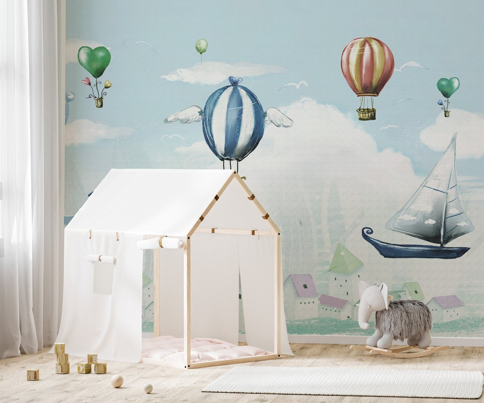 Light Blue Balloon Whale Wall mural with a small white play tent.