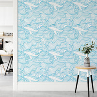 Light blue and white whale pattern wallpaper in a modern hallway setting.