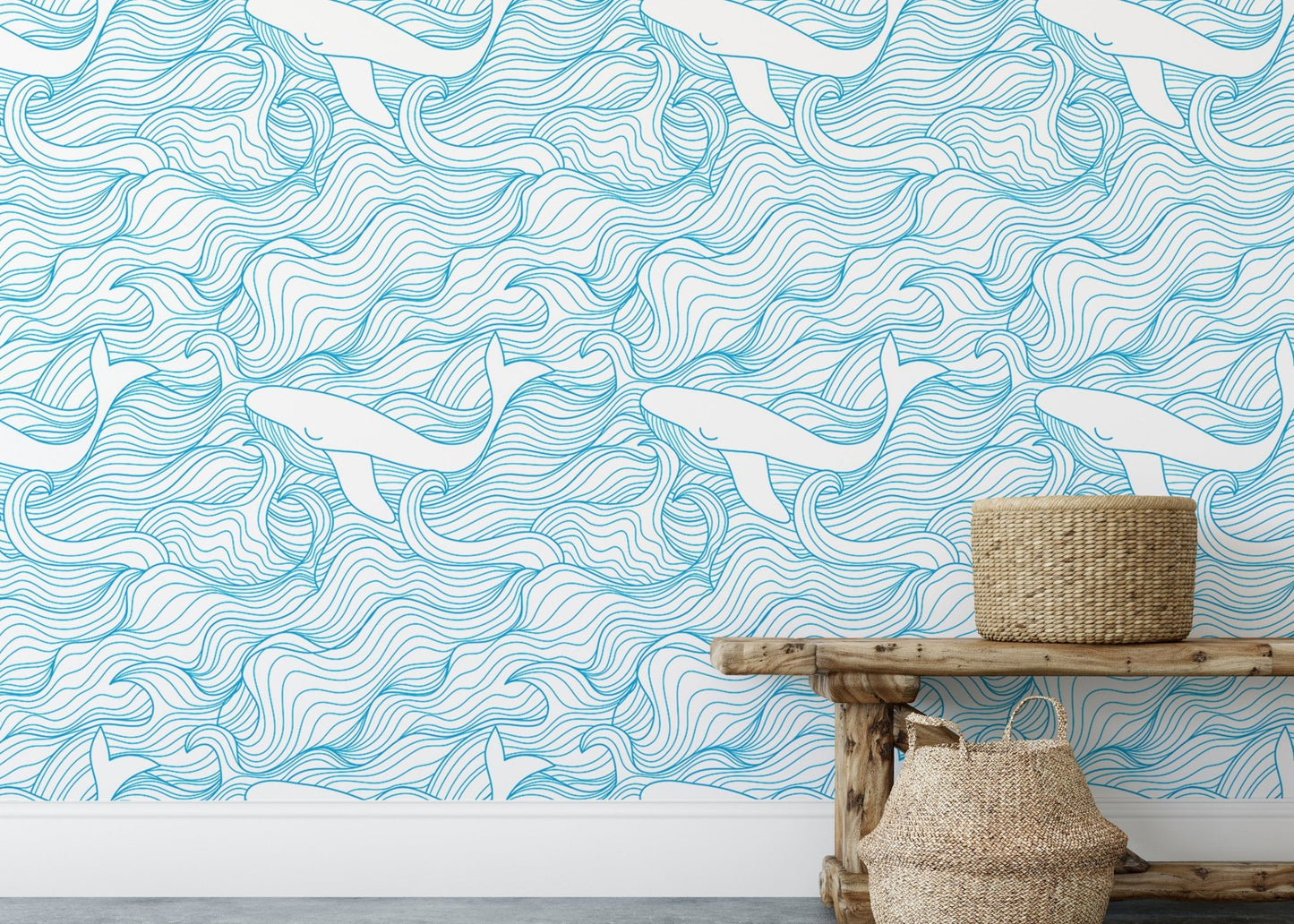 Blue ocean wave wallpaper behind a wooden bench with woven baskets.