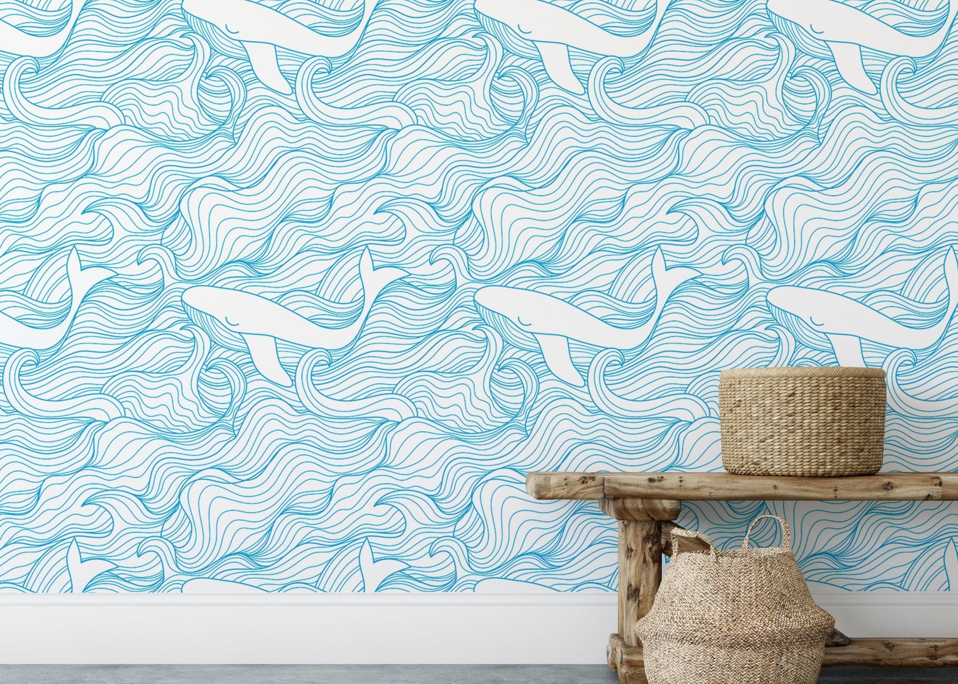 Blue ocean wave wallpaper behind a wooden bench with woven baskets.