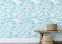 Blue ocean wave wallpaper behind a wooden bench with woven baskets.