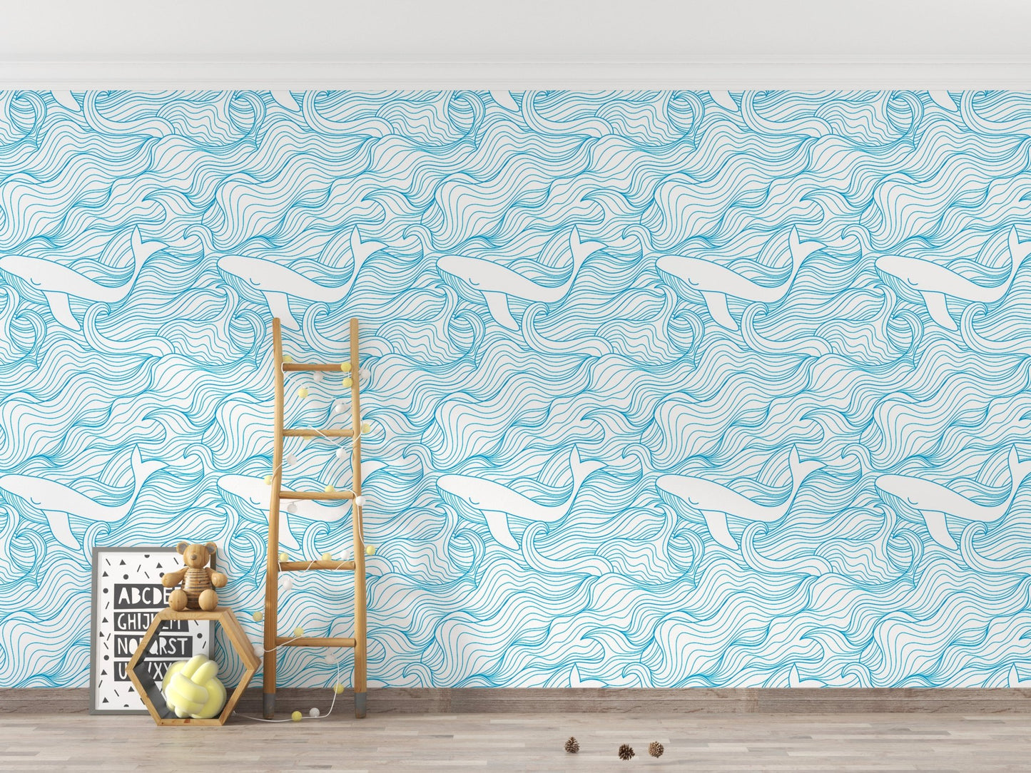 Blue stormy waves wallpaper in a playroom with a wooden ladder and toys.