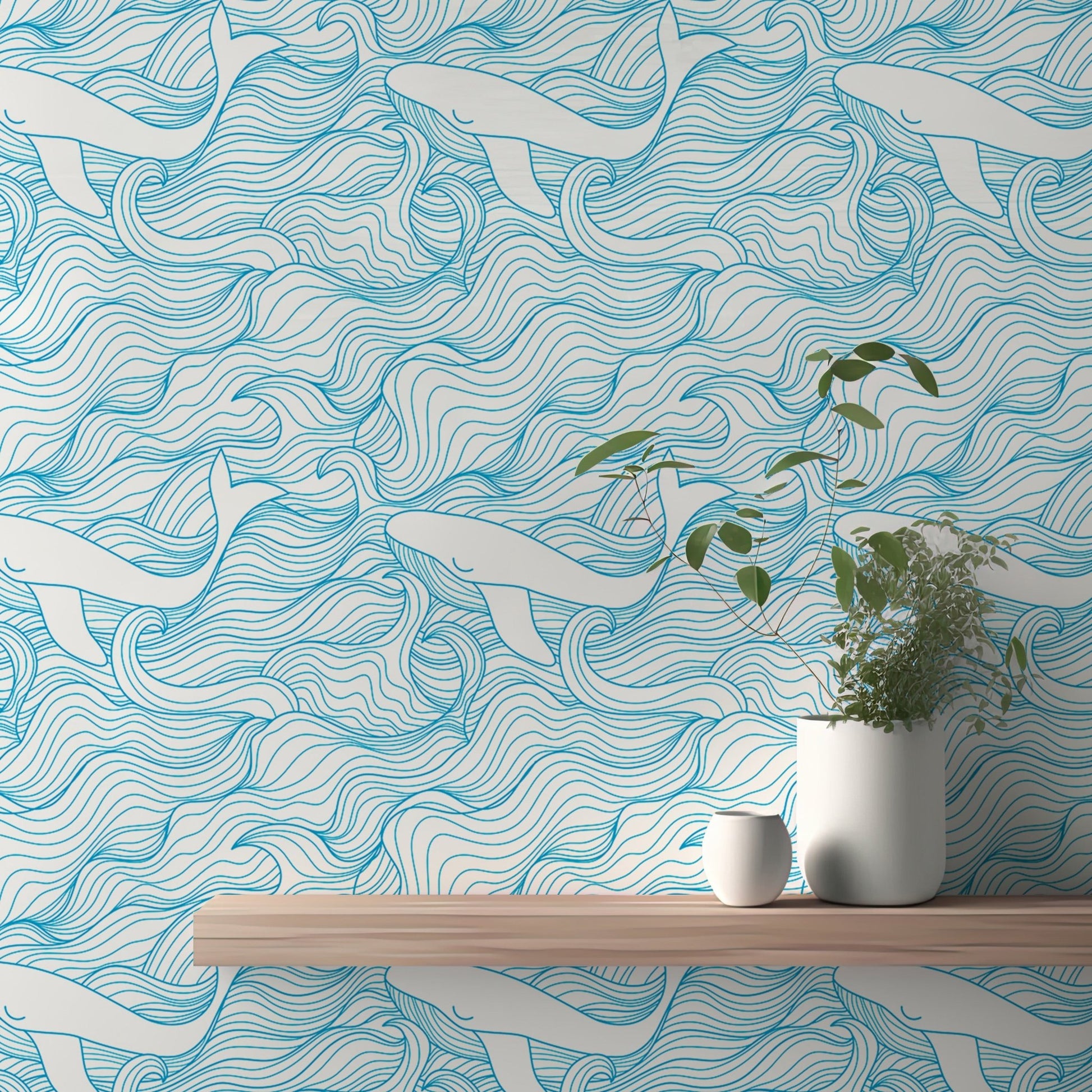 Blue wave and white whale wallpaper behind a wooden shelf and potted plant.