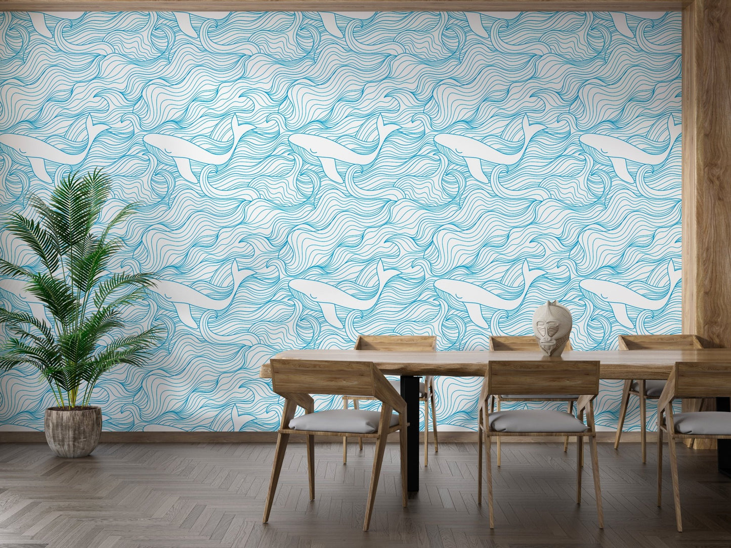 Nautical theme wallpaper featuring whales in a dining room with wooden furniture.