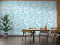 Nautical theme wallpaper featuring whales in a dining room with wooden furniture.
