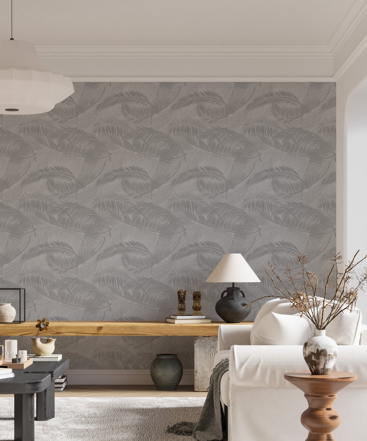 Contemporary living area with neutral tones and gray palm leaf wallpaper.