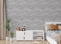 Small bedroom layout with white furniture and palm leaf silhouette wallpaper.