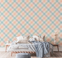 Bedroom featuring a light wood bed frame and pastel geometric wallpaper.