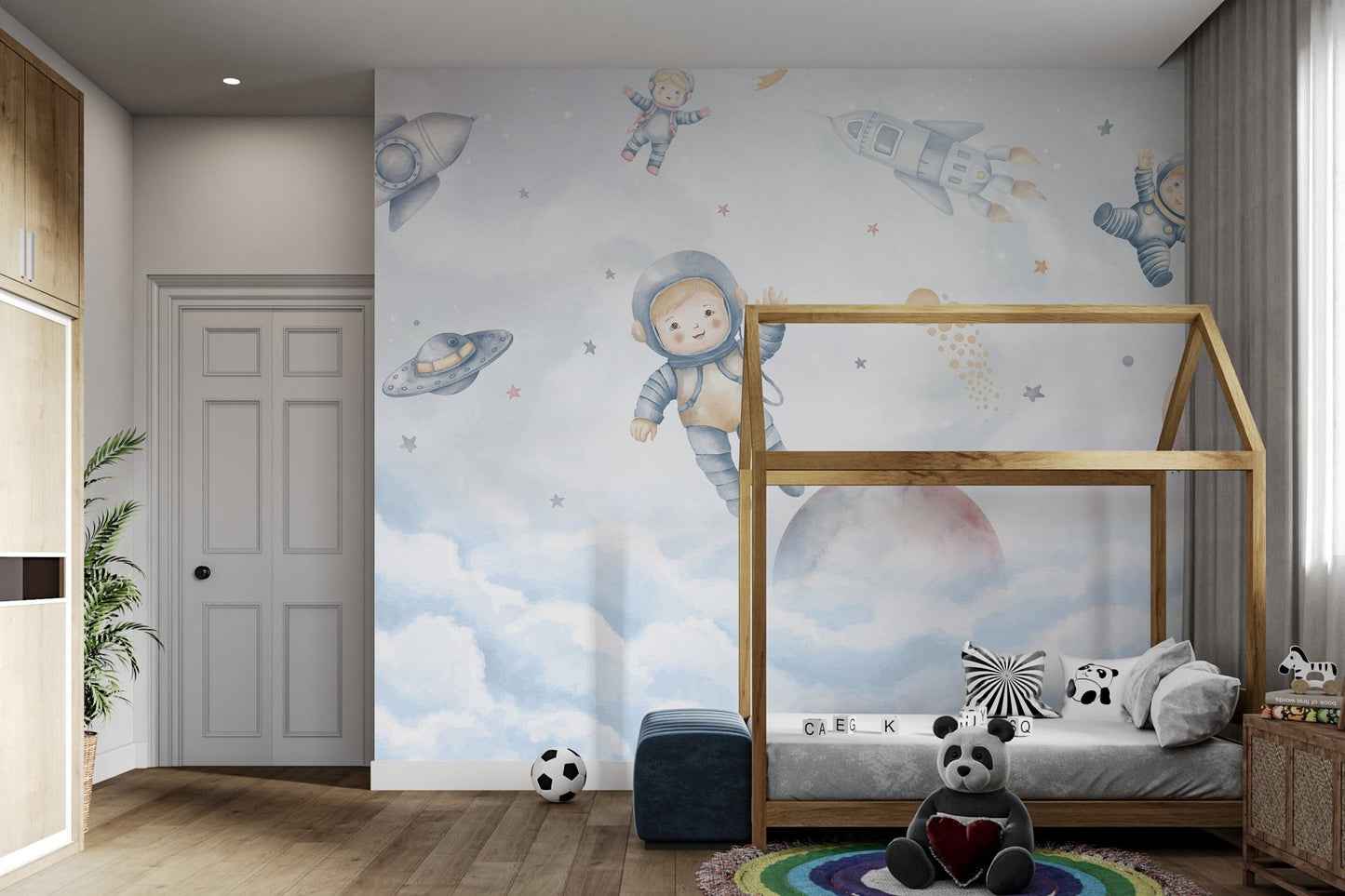 Minimalist space themed wall mural with cute astronauts and rockets.