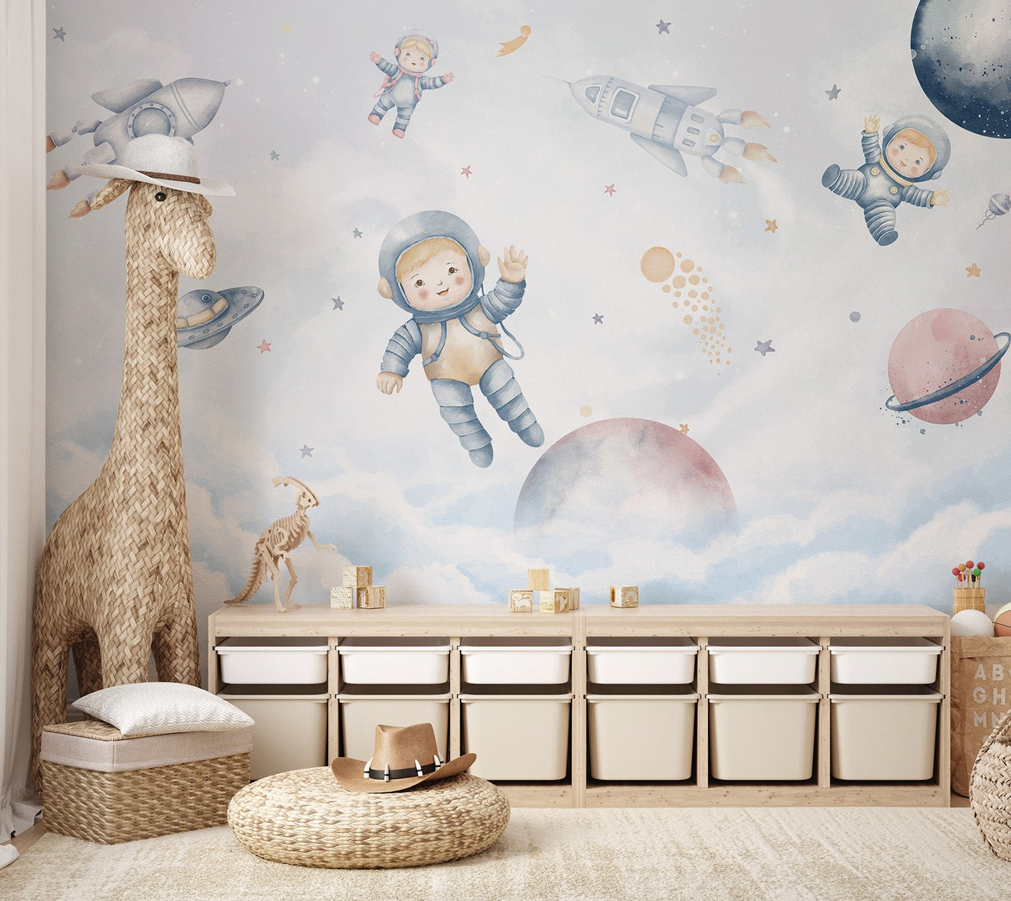 A playful space mural with little astronauts and rockets for nursery.