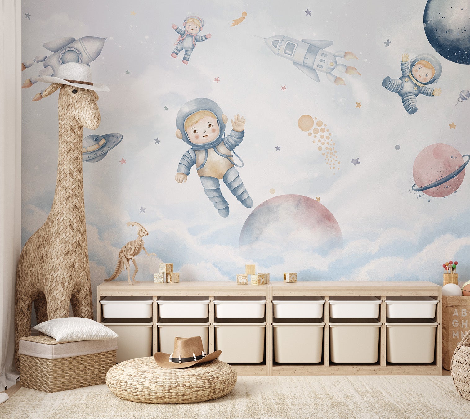 A playful space mural with little astronauts and rockets for nursery.
