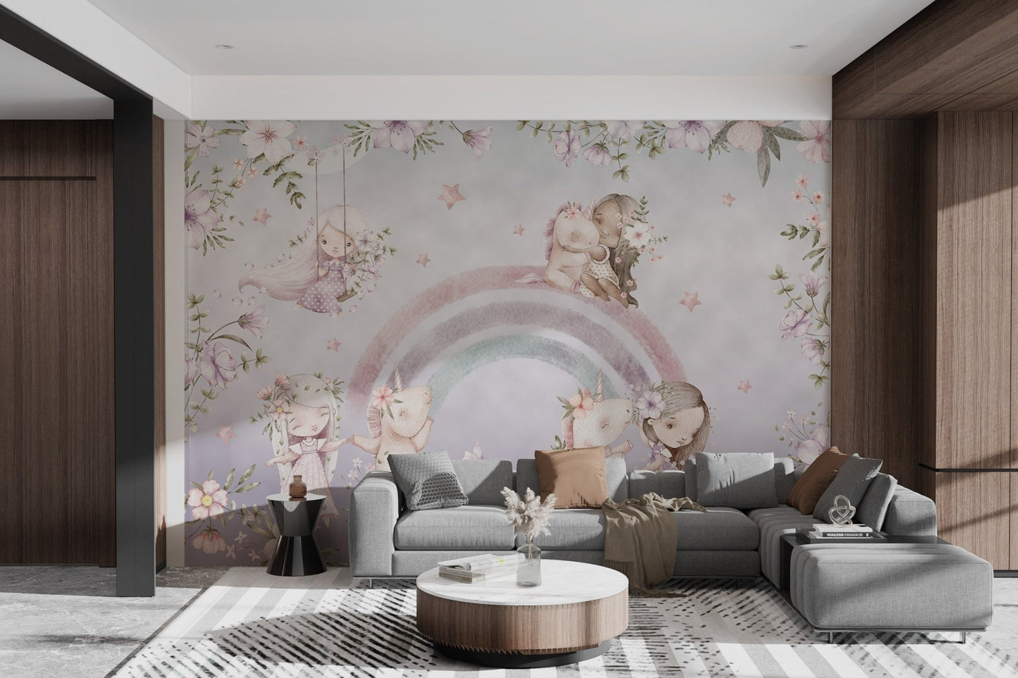 Child and unicorns playing on rainbow wall mural in bright living space.