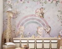 Fairy tale wall mural showing girls playing with unicorns near a rainbow.