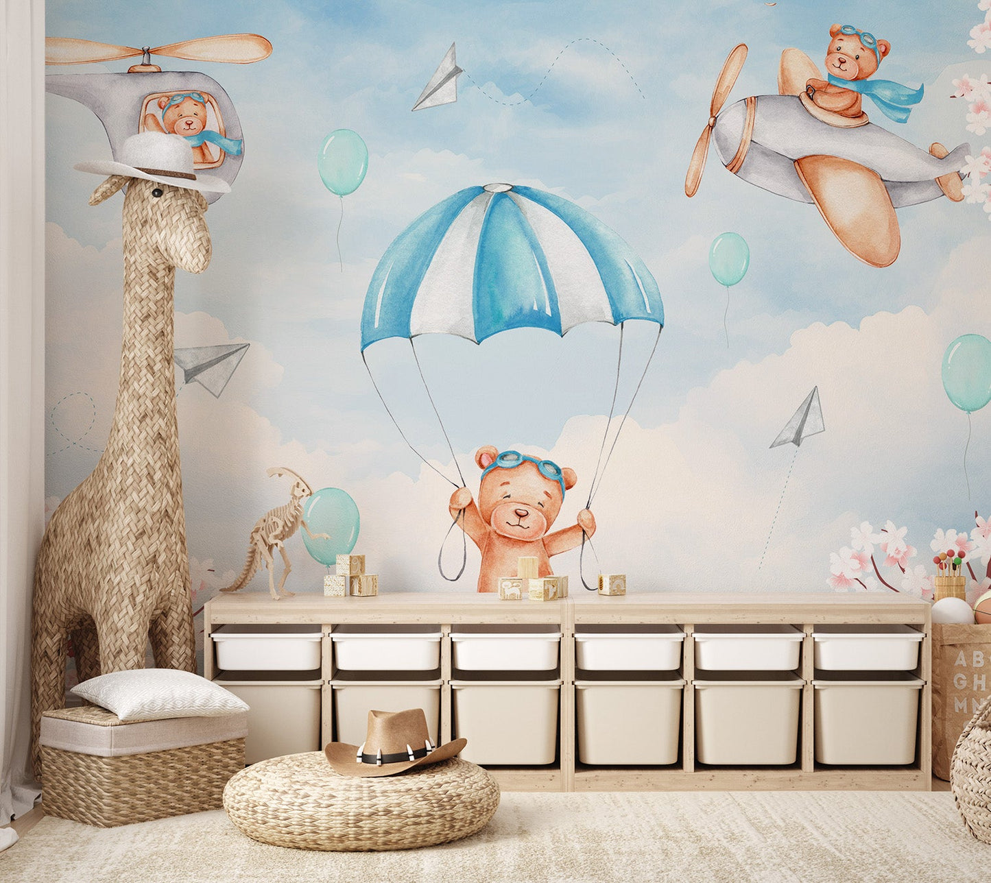 Illustrated wall mural with a teddy bear in a helicopter over white fluffy clouds.