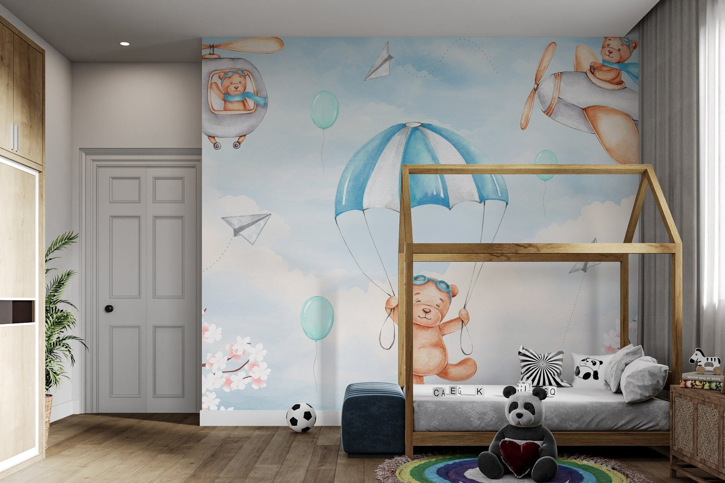 Soft blue wall mural with teddy bears as pilots for children's bedroom.