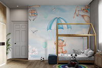 Soft blue wall mural with teddy bears as pilots for children's bedroom.