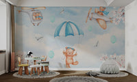 Kids study room mural with light blue balloons and white cherry branches.